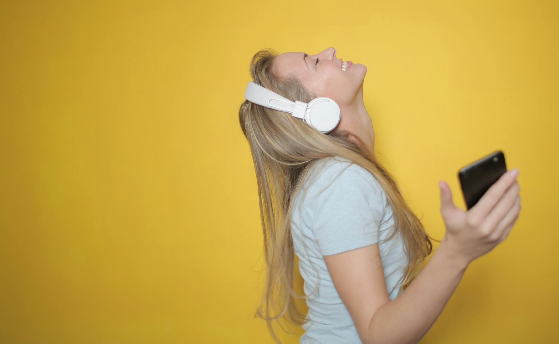 Woman experiencing JOY listening to music